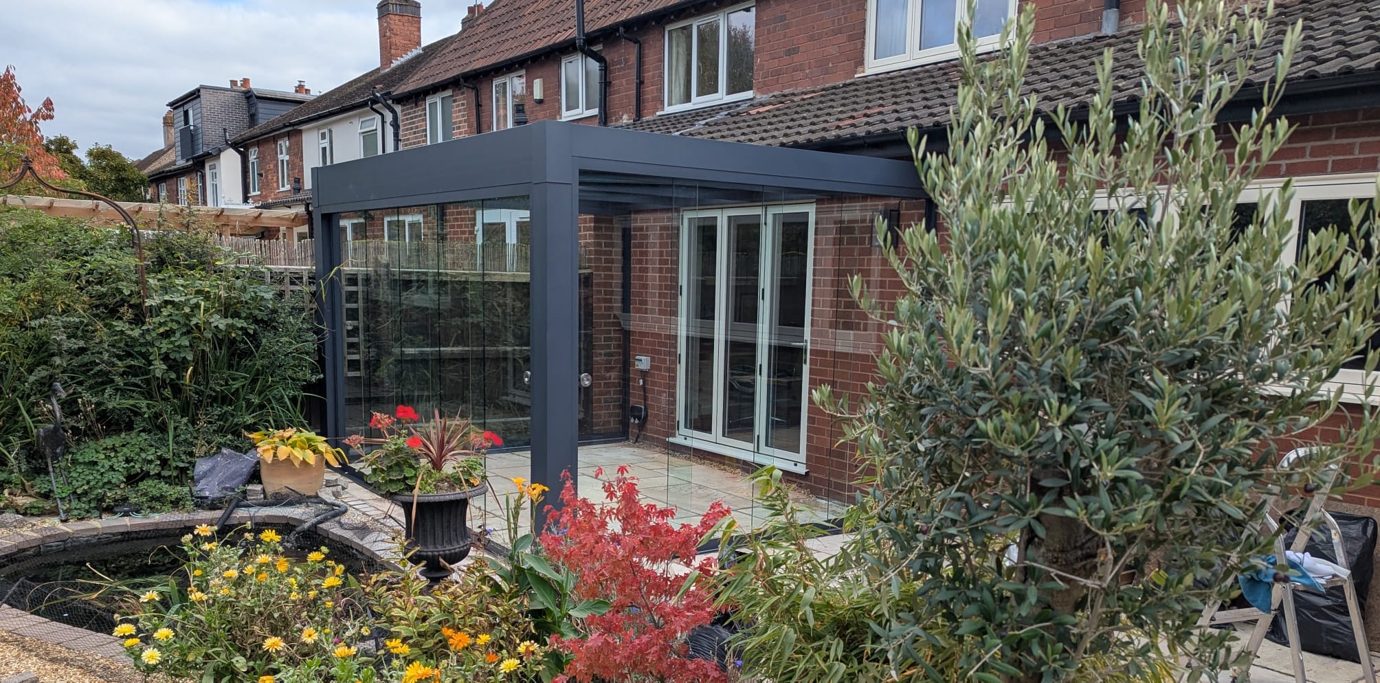 Anthracite veranda on rear of brick home