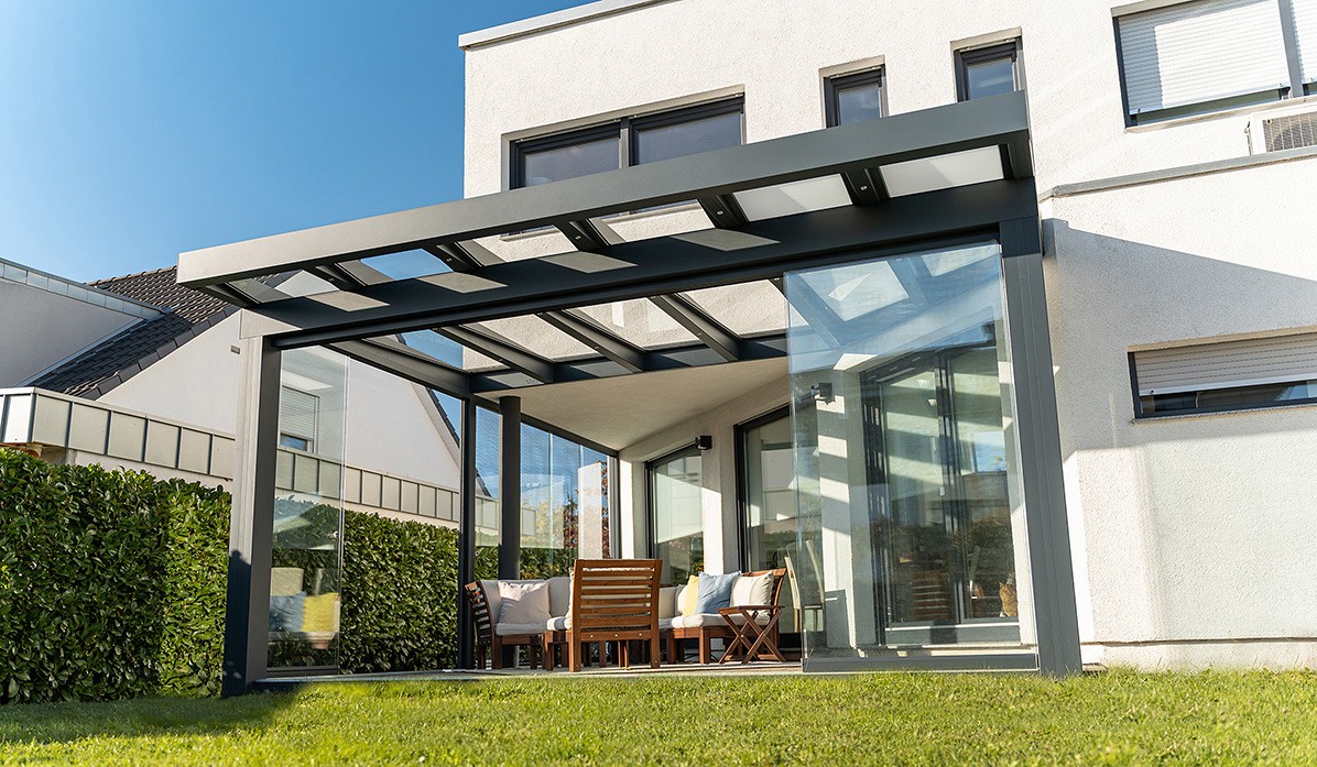 Modern white house with veranda and hedge boundary