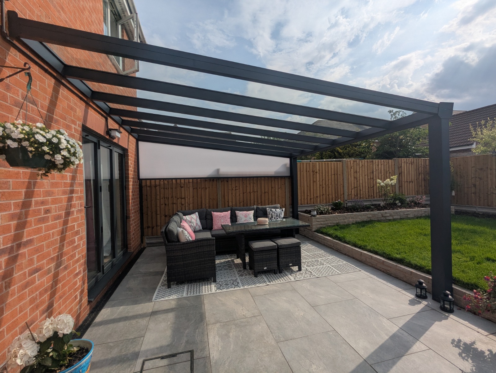 Anthracite veranda over patio with sofa