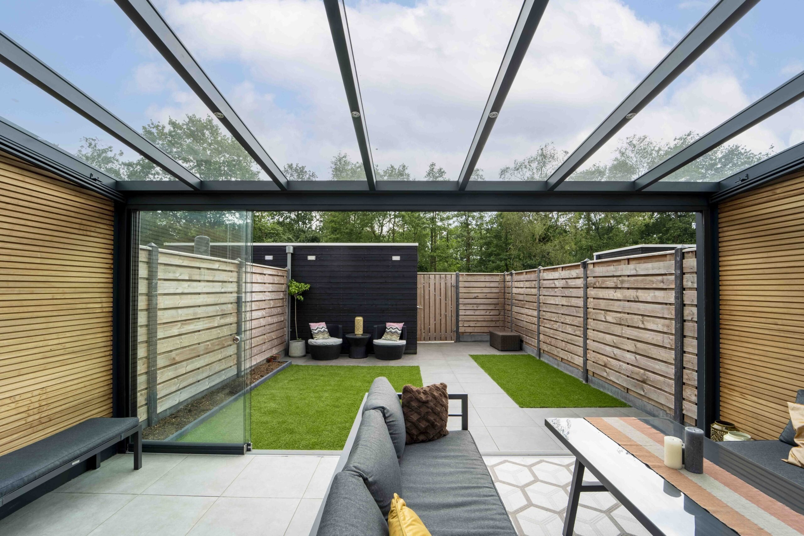 Veranda over patio with grass area and fence