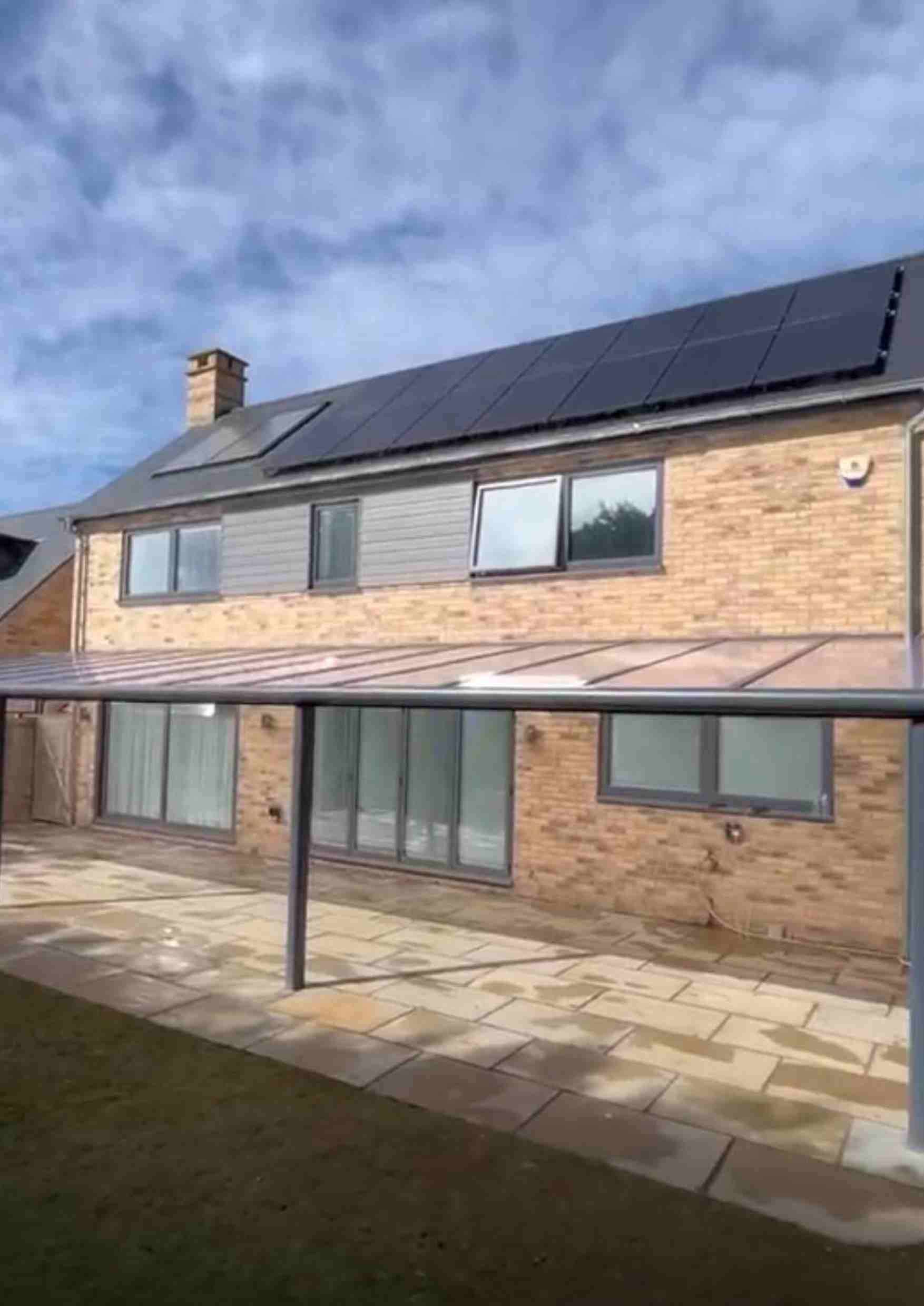 Bosco supply-only polycarbonate-roof veranda on a brick home