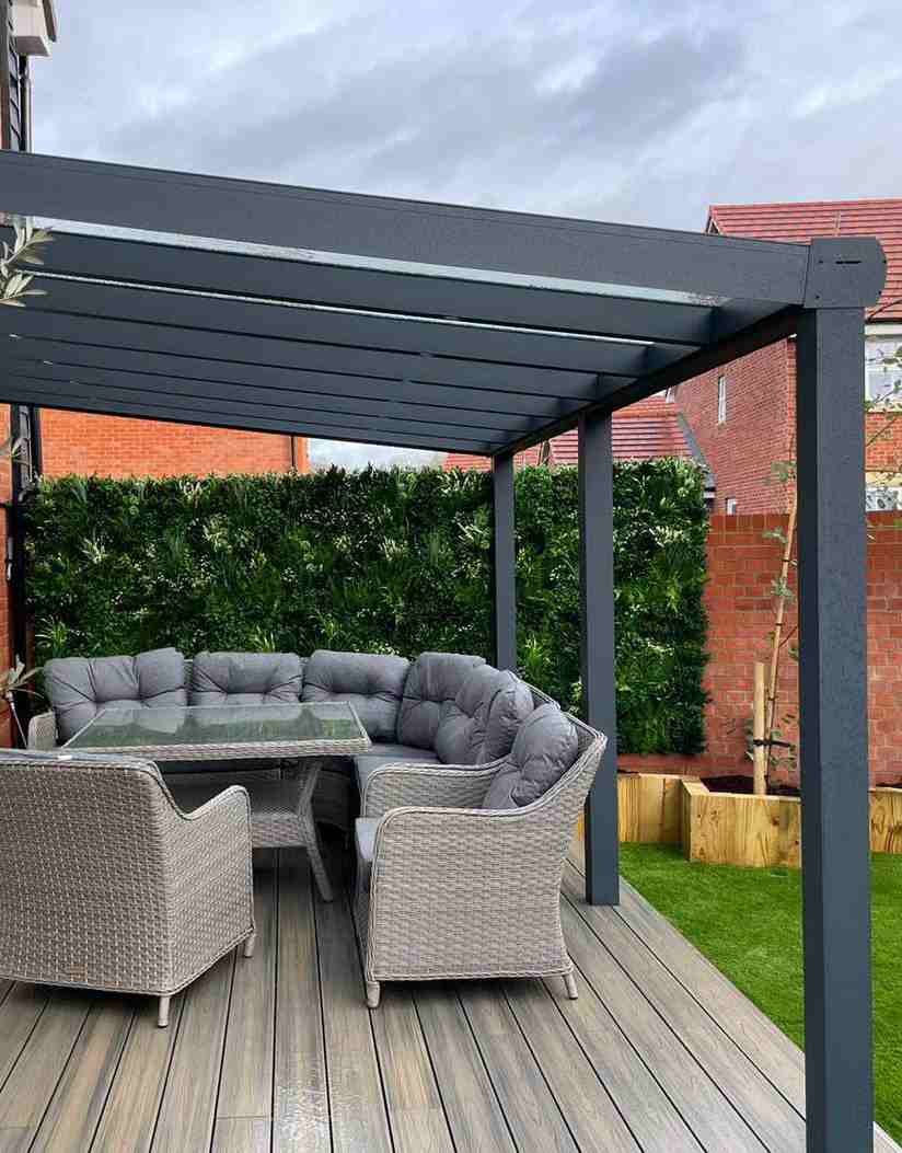 Aluminium supply-only veranda over a decked patio with rattan seating